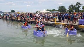 Competitors take off from the start during the tote box race in the harbor during the Wheatley Fish Fest on Saturday.  (Trevor Terfloth/The Daily News)