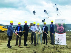 From left: Dennis Haan of Eagle Builders LP, Scott Hine of The Little Potato Company, Sanford Gleddie of The Little Potato Company, Frank Santiago of the Little Potato Company, CEO Angela Santiago, Cameron Naqvi of Cameron Development Corp., and Matt Woolsley of York Reality, broke ground on the future site of the Little Potato Company's new packaging facility in Nisku, June 28. (supplied)