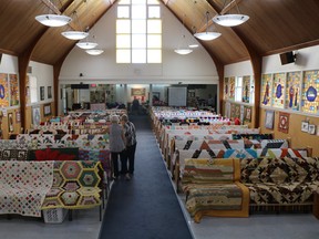 Over 60 quilts were spread across the pews of St. David’s United Church for the ‘For the Love Of Quilts’ fundraiser, June 29. (Peter Williams)