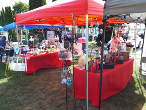 Artists prepare their booths during 2019's Art in the Park hosted by Arts Quinte West. The event is set to return on July 16. Submitted