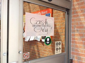 A sign on the Metro store in Owen Sound advises customers that they were accepting only cash and credit purchases under $200 on Friday, July 8, 2022.