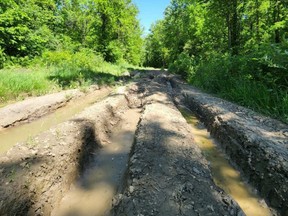 Deep ruts and property disruption caused by unauthorized vehicle use on Saugeen Valley Conservation Authority lands.