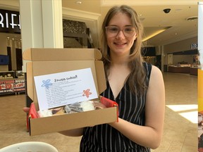 Vanessa Beaudry holds up one of her dessert kits during Friday's summer company pop up shop at Northgate Shopping Centre. Nine young entrepreneurs were funded to operate their business ventures over the summer, some of which include lawn care services, custom clothing, textured art, crystals and baking kits.
