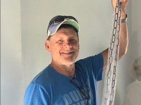 Ukrainian Village of Owen Sound steering committee member Neale Kemp works on renovating the Rice House in Owen Sound.