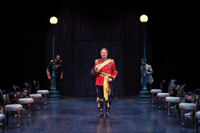 Rylan Wilkie as Parolles with Michael Blake (left) as First Lord Dumaine, Irene Poole as First Soldier and members of the company in All's Well that Ends Well.  Stratford Festival 2022. Photo by David Hou.