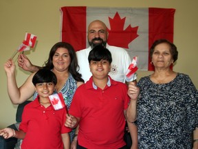 The Al Massad Family celebrate June 28 right after Sharif became a Canadian citizen. From left in front are Joseph, George and Wedad. In back are Abeer and Sharif. Handout