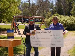 The Batawa Lions Club receive a $500 cheque from the Lions Foundation of Canada during their community BBQ. Submitted