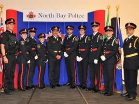 Deputy Chief Michael Daze, Cst. Matthew Kliewer, Cst. Meranda Wood, Cst. Christina Buckland, Cst. Tonisha Maisonneuve, Chief of Police, Scott Tod, Cst. Dale Valade, Cst. Cameron Ladouceur, Cst. Kaleb Mueller, Cst. Christopher Dahlke and Inspector Jeff Warner pose for a picture Monday during the swearing-in ceremony.