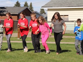 Briennne, Cassie and Russell, all 11, Chelsea, nine, Hallie, 11, and Cameron, eight, competed in egg-and-spoon races at Wedow Park during the first park party. The next is set for Athabasca Park at 8 Torgerson Drive on Wednesday, July 20.