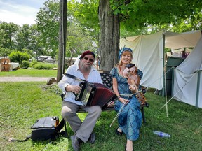 Musicians Paul and Gwen pose with their melodeon and viola d'amore. The duo provided live music for the event. Victoria Acres photo