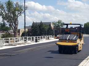 Paving work is shown on the Third Street bridge in downtown Chatham last week. (Trevor Terfloth/The Daily News)