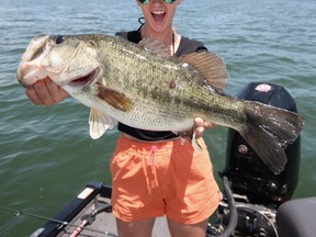 Shelby Gustafson with a nice large mouth bass. Fishing in new areas will teach you new things and make you a better angler.