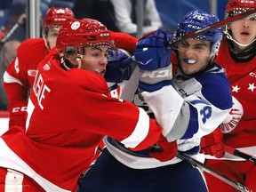 Andre Anania, right, of the Sudbury Wolves, attempts to skate past Soo Greyhounds defender Caeden Carlisle during OHL exhibition action at the Sudbury Community Arena in Sudbury back in October. Carlisle is one of 10 Hounds players from last year's roster who are currently participating in NHL development camps.