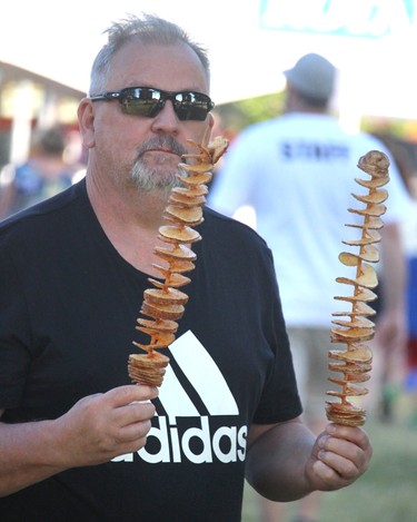 Rob Morley with tornado potatoes at Rotaryfest at Clergue Park on Thursday, July 14, Sault Ste. Marie, Ont. (BRIAN KELLY/THE SAULT STAR/POSTMEDIA NETWORK)