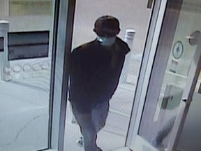 Fort Saskatchewan RCMP are searching for an armed robber that hit the Westpark Shoppers Drug Mart on Sunday, July 17. The suspect was wearing a black baseball hat, black sunglasses with orange lenses, blue COVID mask, black Adidas sweater, white t-shirt, blue jeans and was carrying a reusable Safeway bag. Photo courtesy RCMP