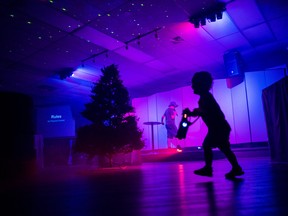 Two-year-old Hudson Kinmond plays laser tag inside the At The Crossroads Church during the return of Trenton's Festival on the Bay on Saturday in Quinte West, Ontario. ALEX FILIPE