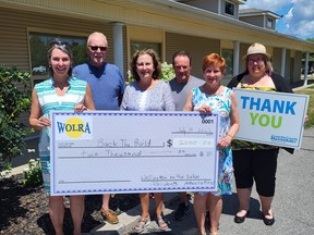 Pictured at the Wellington on the Lake Clubhouse from left: Shannon Coull, executive director of the PECMH Foundation; WOTL Volunteer, Derek Mendham; WOTL Board Members Kathy Memme, Rick Stevens, Brenda Little and Briar Boyce, senior development officer of the PECMH Foundation.