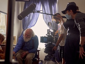 From left, actors Ashton Cressman and John Dolan perform in front of the camera while photography director Max Mezo and director Samuel G. Davey work behind the scenes during the shooting of the short film, Wilfrid, inside the former peopleCare building in Stratford. Submitted photo