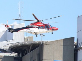 An Ornge air ambulance lands atop Health Sciences North in Sudbury, Ontario on Saturday, July 16, 2022. Ben Leeson/The Sudbury Star/Postmedia Network