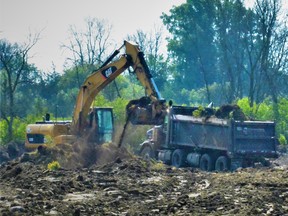 Large construction machinery is clearing a 110-acre greenfield site in Belleville's Northeast Industrial Park to make way for an estimated $135 million 'warehouse' facility set to begin full construction next year. DEREK BALDWIN