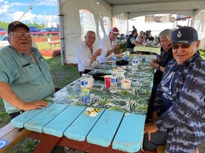Elders from the Fort Chipewyan area socialize at the McMurray Metis grounds after wildfire smoke forced them to stay in Fort McMurray for a week. Supplied Image/ACFN