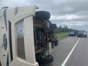 A recreational vehicle flipped on its side Thursday on Highway 69 at French River after striking a set of guardrails.