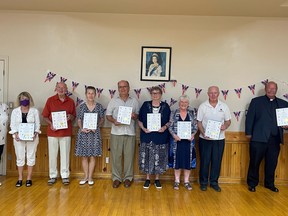 Some of the recipients of the Queen's Platinum Jubilee pins assemble Thursday afternoon at Picton's Legion.