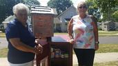 Dorothy Wright-Wallace, president of the Chatham-Kent Black Historical Society, left, and Geri Hughson, founder of FreeHelpCK, are shown beside the new food pantry at BME Freedom Park in Chatham.  (Trevor Terfloth/The Daily News)