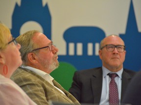 From left, Belleville Coun(s). Carol Fenney, Chris Malette and Sean Kelly watch a presentation outlining possible future green space plans for an 8.4-acre former Bakelite parcel of land approved for a $3.1 million purchase by the city Monday in a special meeting of council. DEREK BALDWIN