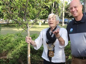 Former Belleville mayor Robin Jeffrey and city mayor Mitch Panciuk dedicated a tree to the former in 2019 to recognize her years of service to city residents as an elected representative who got things done. The city lowered its flag Monday to honour her passing. TIM MEEKS FILE