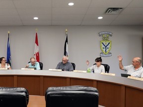 Town council, including (l-r) Derek Schlosser, Serena Lapointe, Mayor Tom Pickard, Bill McAree, Tara Baker and Paul Chauvet met Monday. During the meeting council adopted a cost-sharing agreement with Woodlands County that the county has not endorsed.
