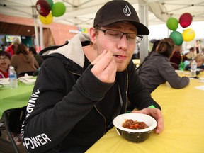Nathan Storey savours a bowl of chili at the Empty Bowls festival, a fundraiser hosted by the Wood Buffalo Food Bank, on September 10, 2017. Olivia Condon/Fort McMurray Today/Postmedia Network