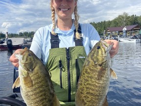 Ali Crandall shows off part of her and Ben Gustafson's winning catch from the Bronzeback Classic on Lake of the Woods over the weekend.