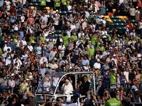 Pope Francis, the head of the Roman Catholic Church, arrives at Commonwealth Stadium in Edmonton, Canada to deliver an outdoor mass on Tuesday, July 26. Larry Wong /Postmedia