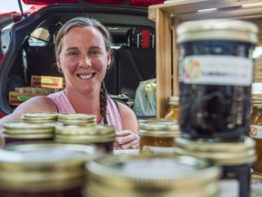 Heather Cox, owner of Jack's Jams & Jellies, sits at her stall in the Belleville Farmers Market as she is surrounded by jars filled with her various homemade, all natural products. ALEX FILIPE