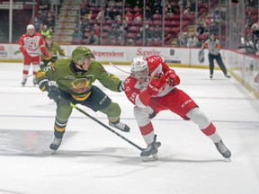 Tnias Mathurin of the North Bay Battalion and Bryce McConnell-Barker of the Soo Greyhounds compete in Ontario Hockey League action at the GFL Memorial Gardens. The Hounds forward was drfted in the third round of the NHL Entry Draft by the New York Rangers.