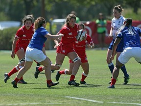 Sophie de Goede makes carries the ball during international rugby action against France in San Diego, Calif., in an undated handout photo. The Canadian captain is looking forward to a rare chance to play at home and to give some members of her family a chance to see her in action for the first time. THE CANADIAN PRESS/HO-Rugby Canada-Travis Prior, 
*MANDATORY CREDIT*