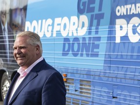 Ontario Premier Doug Ford steps off his campaign bus before making an announcement in Brampton, Ont., on Tuesday, May 24, 2022.&ampnbsp;On the campaign trail this Spring, the Progressive Conservatives promised to raise &ampnbsp;disability support payment rates by five per cent and introduce legislation to tie annual increases to inflation.&ampnbsp;THE CANADIAN PRESS/Chris Young