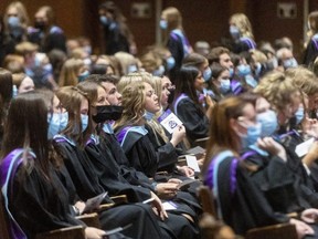 Graduates from the faculty of education at Western University sit in their seats at Alumni Hall on Monday, June 13, 2022. The university's first in-person convocation ceremonies in three years began Monday, and 8,000 grads are expected to cross the stage at ceremonies this week and next. (Mike Hensen/The London Free Press)