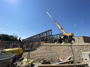 Work has started on a temporary bridge spanning the Saugeen River to connect Goldie and Church Streets in Paisley and serve as the in-town detour for motorists and pedestrians while the existing bridge is closed during construction. Bruce County photo.