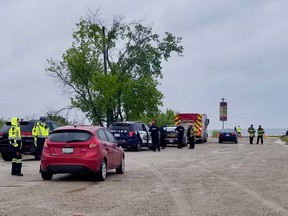 Emergency crews near where a vehicle reportedly entered the water by the end of the pier on the west side of the harbour in Owen Sound, Ont. on Thursday, July 21, 2022. (Scott Dunn/The Sun Times/Postmedia Network)