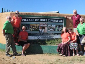 The 2015 Mission Zimbabwe team posing with Village of Hope sign in the outskirts of Harare, Zimbabwe. The village, opened in 2002, cares for over 1,850 children and employs over 80 Zimbabweans according to its website. A three-person Mission Zimbabwe team sponsored by Hanover's Hope Community Church is headed back to the Village of Hope Sunday for the first time in over two years. Photo submitted.