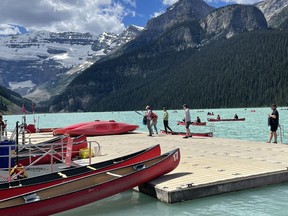 Visitors to the iconic Rockies glacier attraction waited in long lines for a chance to rent and paddle a canoe on Lake Louise's waters on July 20, 2022. Photo Marie Conboy/ Postmedia.