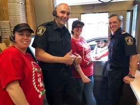 Participants in the 2019 Camp Day gather at the window of the Tim Hortons location at Belleville's Cannifton Road and College Street East. From left were Jen Hurlburt, Belleville Fire Capt. Jeff Keays, Jen Cassalman and Belleville Fire Capt. Mike Bustos.