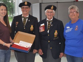 Members of the Ladies Auxiliary of Norwood Legion Branch 300 attended a recent meeting of the Norwood Fair Board. The ladies had noticed that the large Canada Flag that flies above the fairgrounds was starting to look a bit weathered and decided to present the board with a new flag. (ltor) Fair President Krista Tweedie accepts the Auxiliary's generous donation from members Jan Hornsby, Dorthy Fallis and Lynda Pearce. SUBMITTED PHOTO
