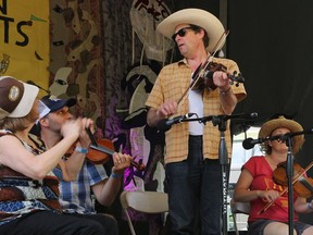 Teilhard Frost, centre, leads the square dance band during the 2019 Skeleton Park Arts Festival in Kingston. Known for his work with musical group Sheesham & Lotus, he's booked to lead workshops during August's Alvar festival in Prince Edward County.