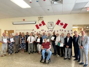 Bay of Quinte MP Ryan Williams, far right, presented Queen's Platinum Jubilee pins to area residents in a gathering Thursday at Royal Canadian Legion Branch 110 in Trenton.