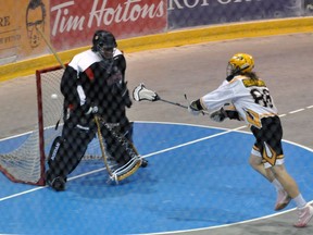 Brantford's Nash Kramer takes a shot against Six Nations goalie Sayoyehdehs Hill in Game 1 of an Ontario Lacrosse Association best-of-five junior C playoff series.