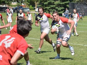 Brantford Harlequins player Tom Van Horne carries the ball with support from Bryan Kushner during a recent Rugby Ontario Marshall Division game. Submitted
