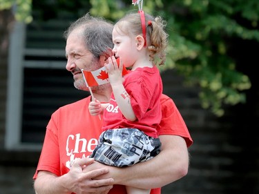 Jamie Martin and his daughter, Cali, 2, watch the Brockville Canada Day parade. (RONALD ZAJAC/The Recorder and Times)